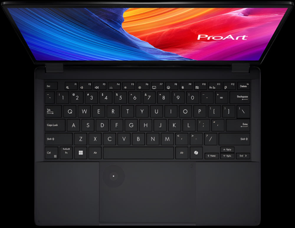Black ProArt laptop with colorful display on a white background